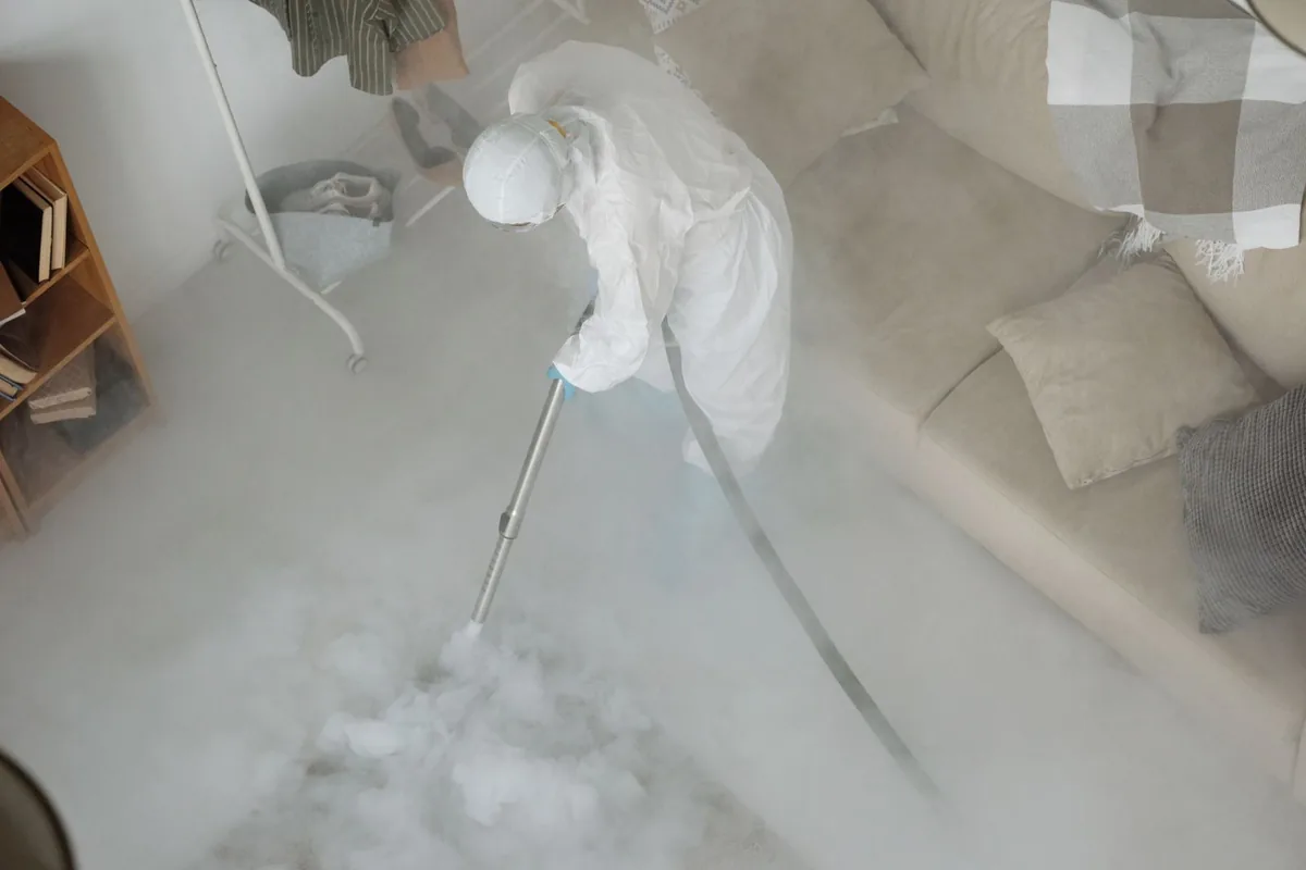 Biohazard cleanup technician in protective equipment, Centreville, AL